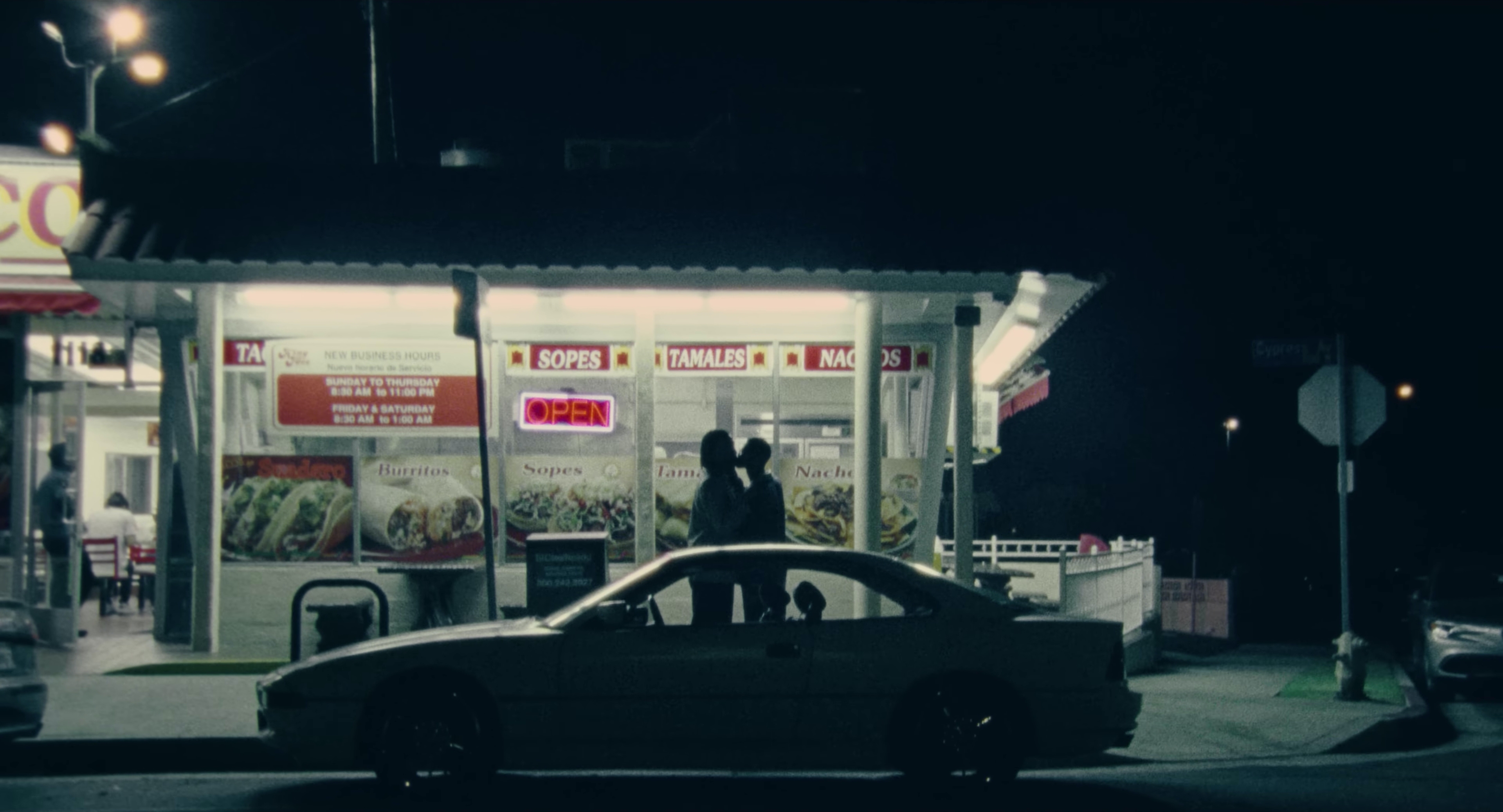 A film still from Love Me Like This showing a couple in a romantic embrace