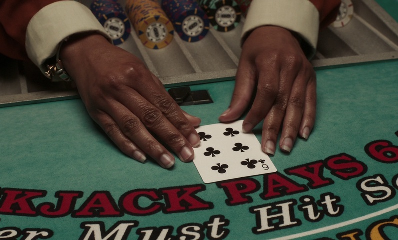 The Final Hand short film still featuring a poker table and playing cards